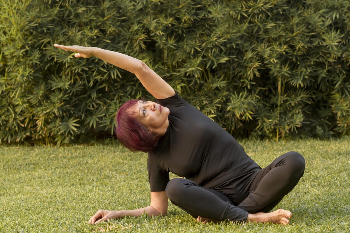 woman sitting yoga position stretching